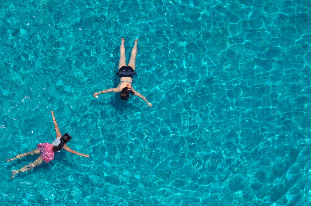 Two girls swimming